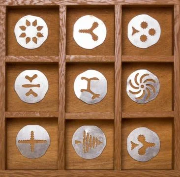 Shadow box with antique cookie cutters Stock Photos