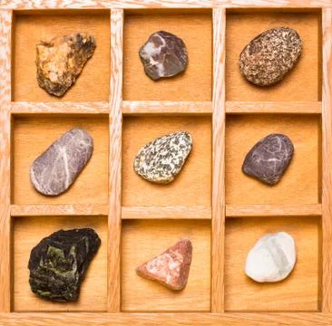 Shadow box with collection of rocks 写真素材