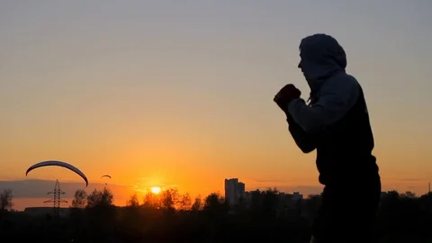 Shadow boxing on sunset,fighter Training Stock Footage 75784025