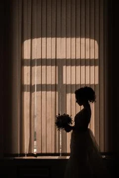 Shadow of the bride with bouquet Stock Photos