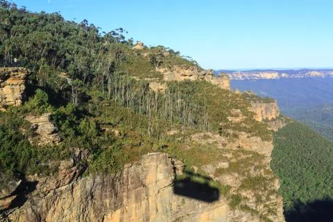 Shadow of a cable car on a cliff in the Blue Mountains, Australia Stock Photos