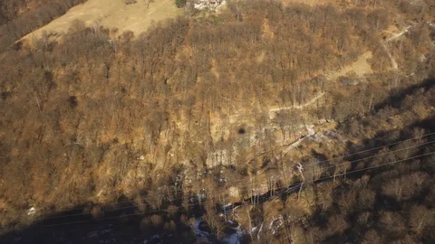 Shadow of a Cable Car Heading Up to Alps mountains in Autumn Stock Footage 73735014