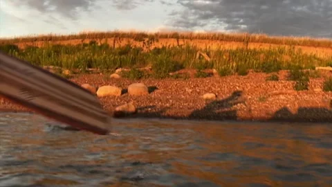 Shadow canoeing along the rugged virgin prairie, Missouri River, South Dakota Stock Footage 146292080