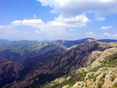 The shadow of the cloud is on the rocks in the mountains of Bulgaria Stock Photos