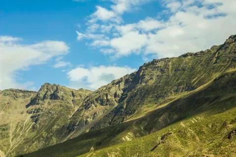 Shadow of clouds on mountain slopes Stock Photos