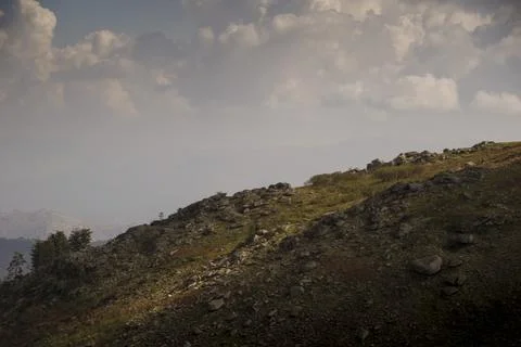 Shadow contrast from the clouds in a Mountain landscape Stock Photos