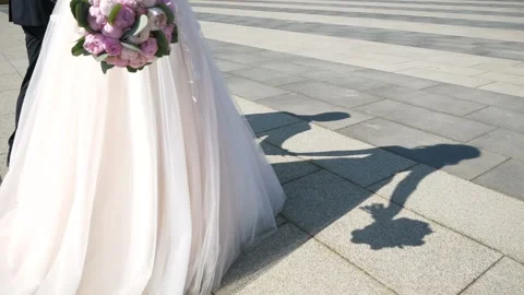 Shadow of the couple on the asphalt. Stock Footage 99389665