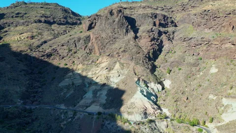Shadow creeping over Los Azulejos de Veneguera in Gran Canaria Stock Footage 313548451