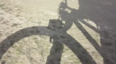 Shadow of a cyclist Stock Footage 61160793