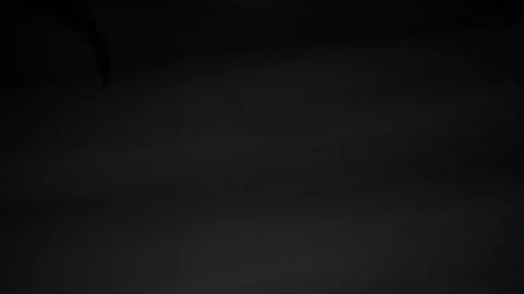 Shadow of death slowly moving on dark background. Stock Footage 130361487