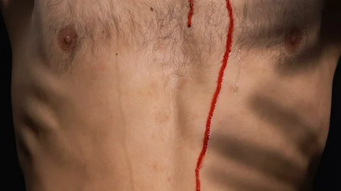 Shadow of demons under bleeding body, taking sinner soul to hell, punishment Stock Footage 108009700