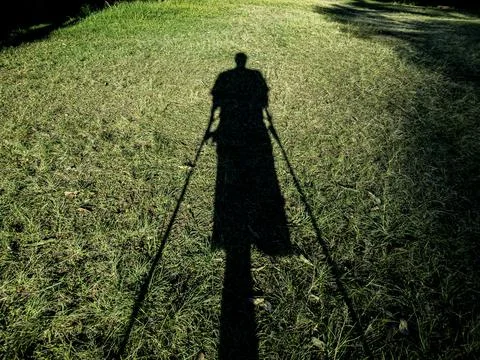 Shadow of a disabled person. Stock Photos