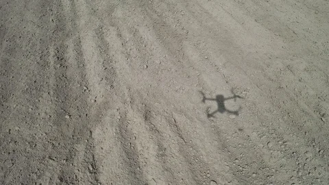 Shadow of a drone on the ground Stock Footage 128285330
