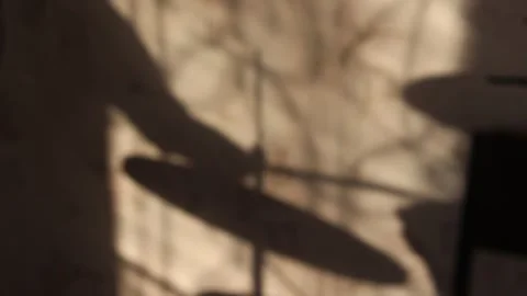 The shadow of the drummer playing on the ercussion instrument Stock Footage 241659294