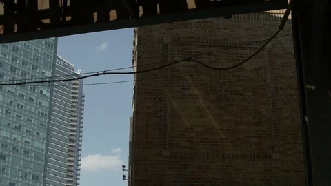 Shadow of Elevated Subway On Building Exterior Stock Footage 77506067