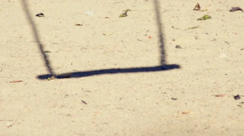 Shadow of empty swing in a playground Stock Footage 45988315