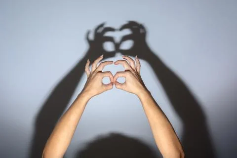 Shadow of evil hands on the wall. halloween prank Stock Photos