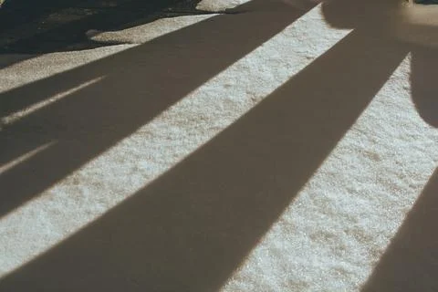 The shadow falling on the snow Stock Photos