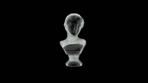 The shadow falls on a white antique bust against a black background and turns it Stock Footage 152640633