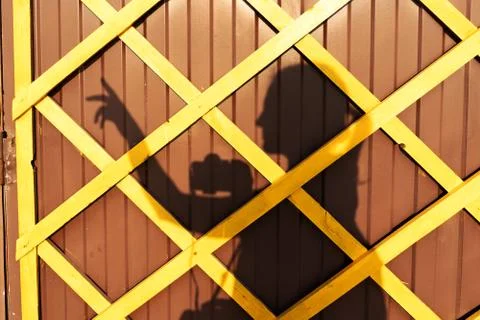 Shadow of feman on the wall Stock Photos