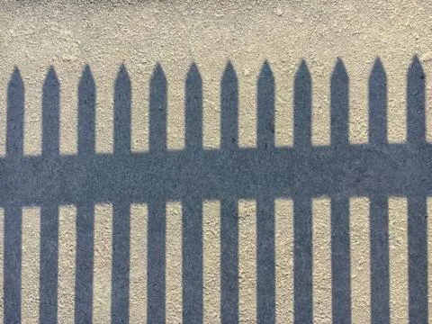 Shadow of a fence Stock Photos