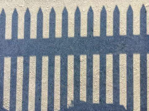Shadow of a fence . Stock Photos