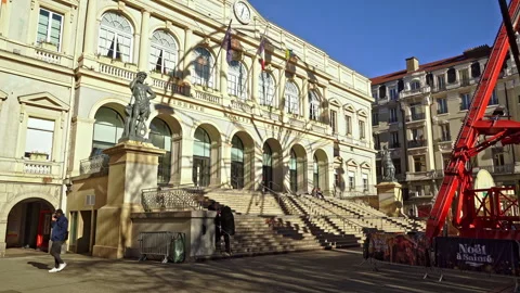 The shadow of the Ferris wheel in Place de l'hôtel de Ville on the Town Hall Stock Footage 268617919