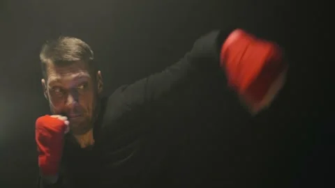 Shadow fighting boxer preparing to training session. Sportsman. Fighter man Stock Footage 161047950