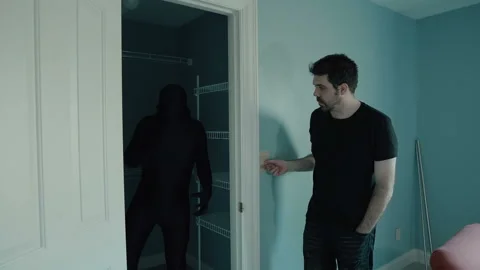 Shadow figure in closet lights flicker Stock Footage 152350745