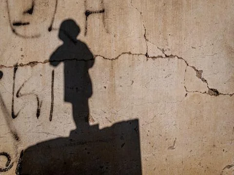 The shadow of a figure on the wall Stock Photos