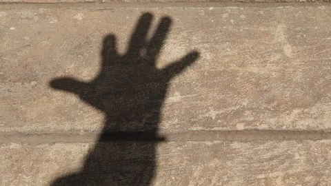 Shadow of fingers exercise on cement background Stock Footage 150033265