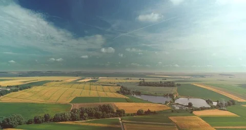 The shadow of a flying plane and its trajectory on the sky over the fields with Stock Footage 127037201