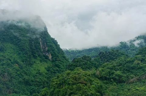 In the shadow of giants, our spirits soar high above the clouds. The rugged.. Stock Photos