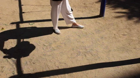 Shadow of a girl playing on the swing Stock Footage 40858055