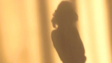 Shadow of a girl on the wall in the sunlight Stock-Footage 73837991