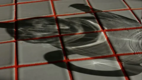 The shadow of a glass teapot on a tiled table,  time-lapse. Stock Footage 154023902