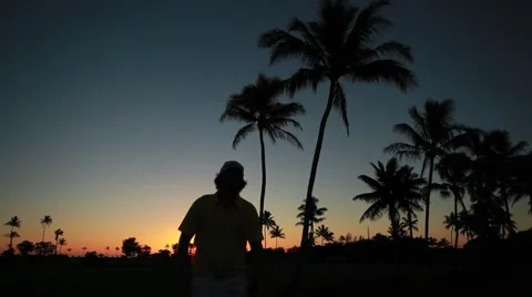 Shadow of a golfer walking to the course during sunrise Stock-Footage 48551694