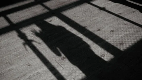 Shadow From Ground Hand's Female move and hold on Metal Window Stock Footage 128679759
