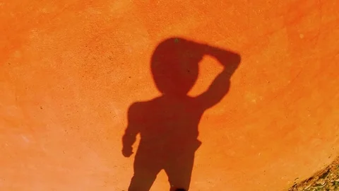 Shadow of a guy in a Panama hat. wind 動画素材 341917242