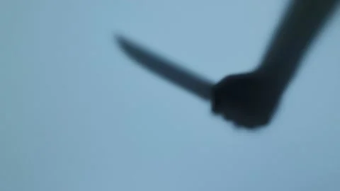 Shadow of the hand with big knife. Murderer, killer or robber. Horror concept Video stock 225422761