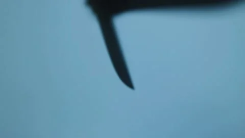 Shadow of the hand with big knife. Murderer, killer or robber. Horror concept Stock Footage 225422814