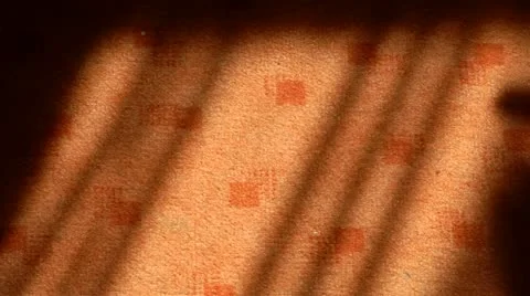 Shadow by hand the person in the form of a hare on a lying oriental carpet Video stock 11854694