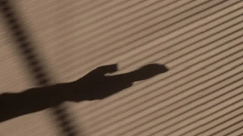 Shadow of a hand scrolling and typing on a smartphone with notifications Stock Footage 331455699