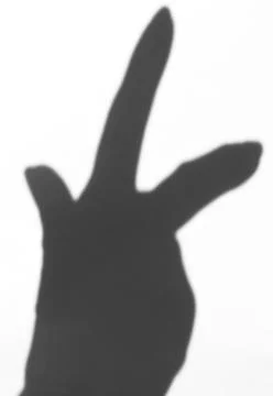 The shadow of the hand white background close-up Stock Photos