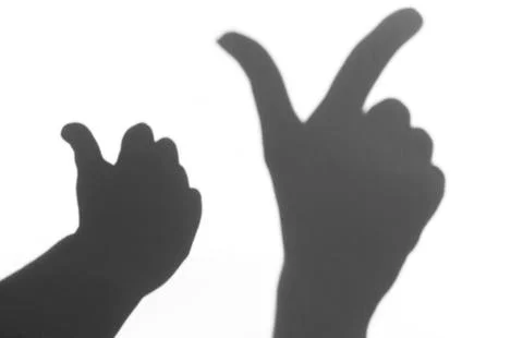 The shadow of the hand white background close-up Stock Photos