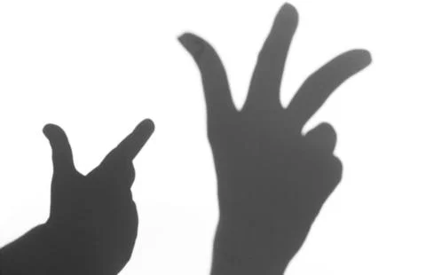 The shadow of the hand white background close-up Stock Photos