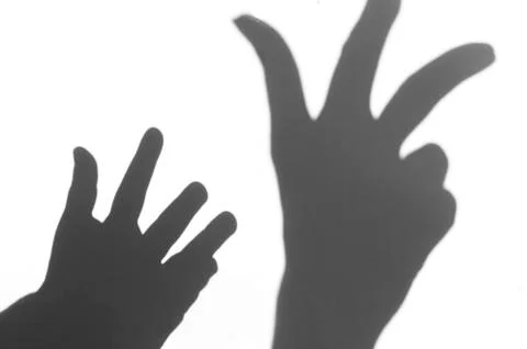The shadow of the hand white background close-up Stock Photos