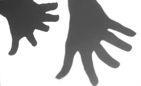 The shadow of the hand white background close-up Stock Photos