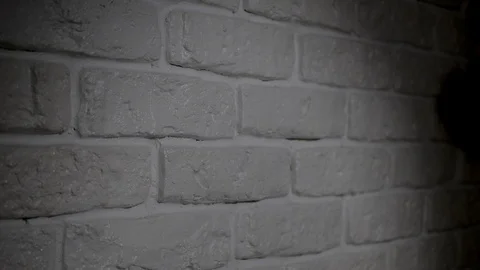 Shadow of hands on the brick wall making a deal. Two businessman are making a Video stock 124018641