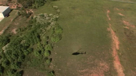 Shadow of helicopter lands at airbase 스톡 동영상 41071764